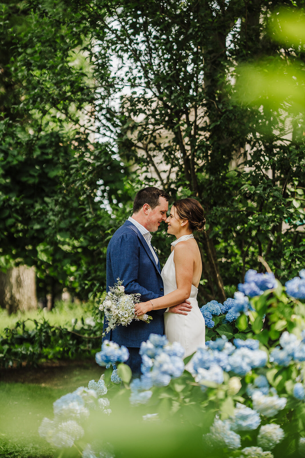 couple elopes in june with hydrangeas