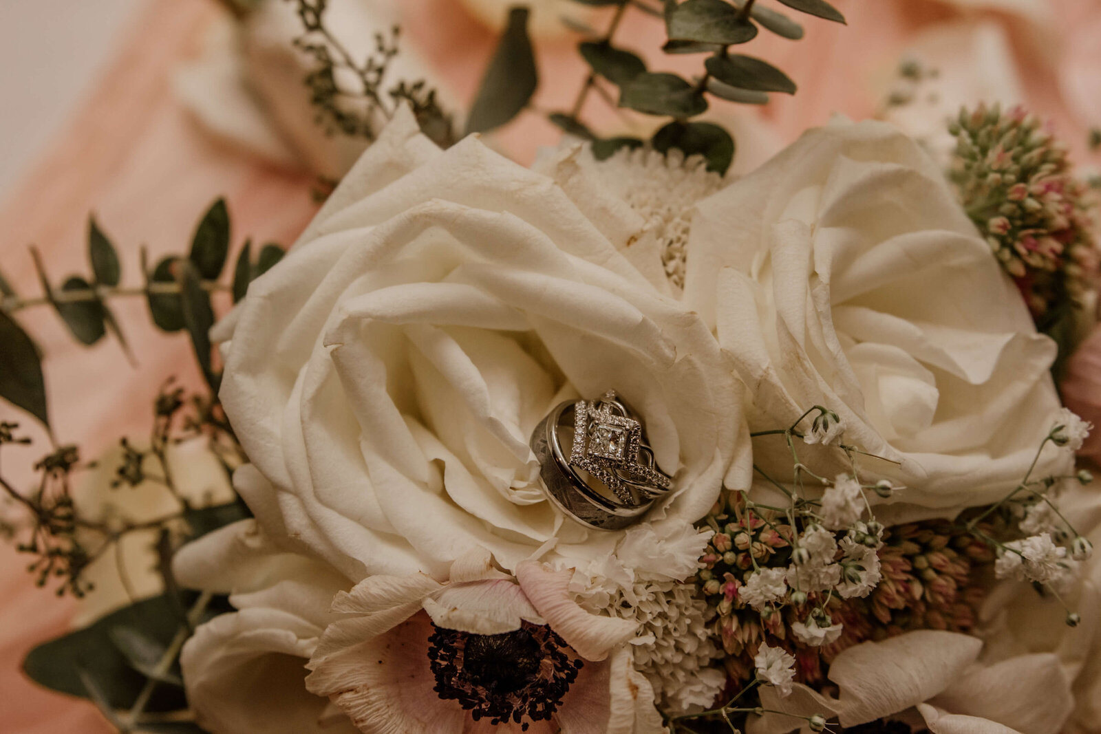 Wedding rings in flowers.