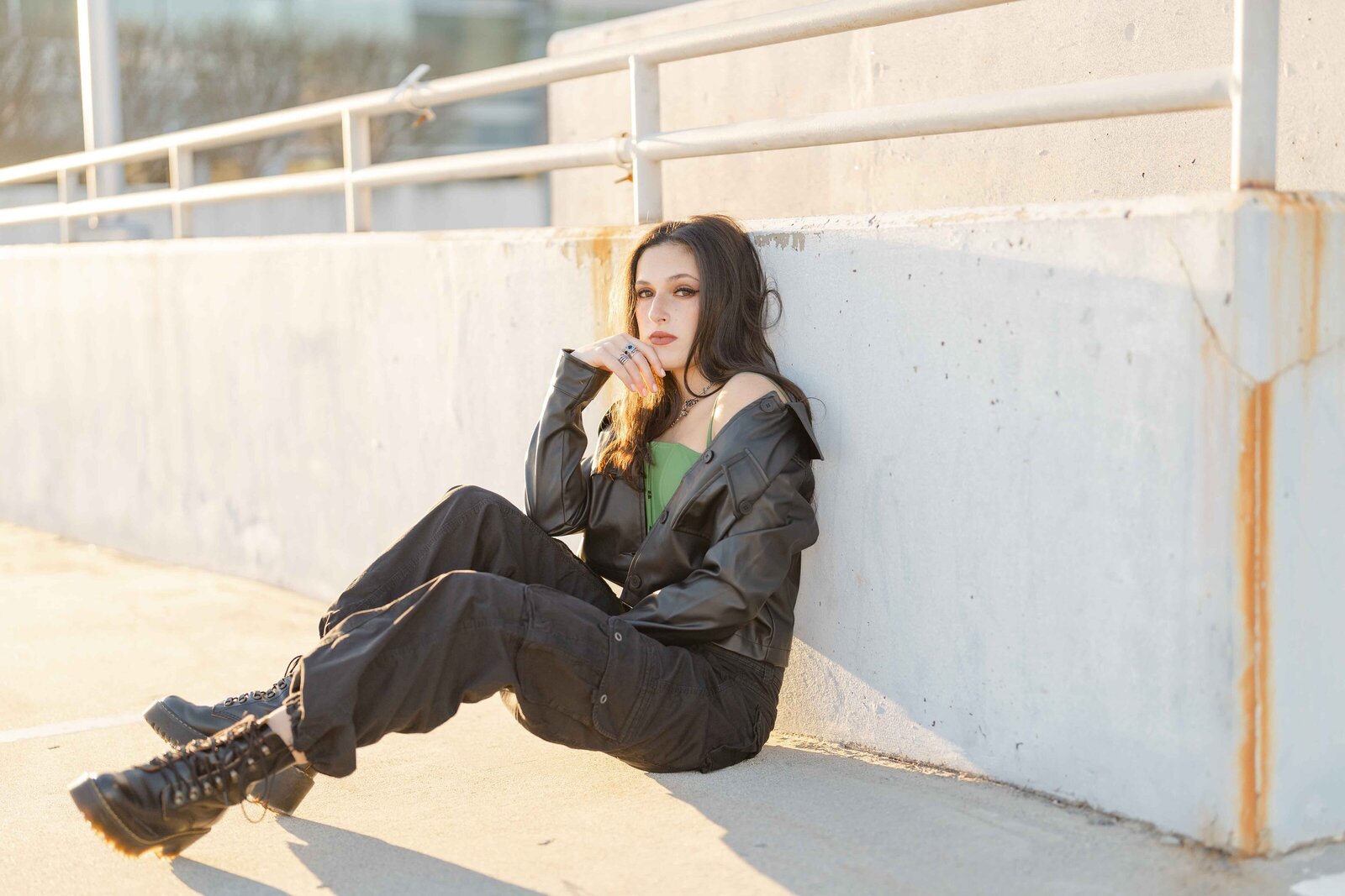 girl sitting in a parking garage during Fairfax County, Virginia senior session