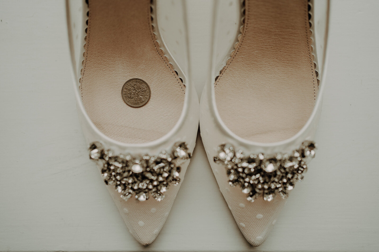 close up of brides wedding shoes with cluster of diamonds on each shoe fun aberdeen wedding photography