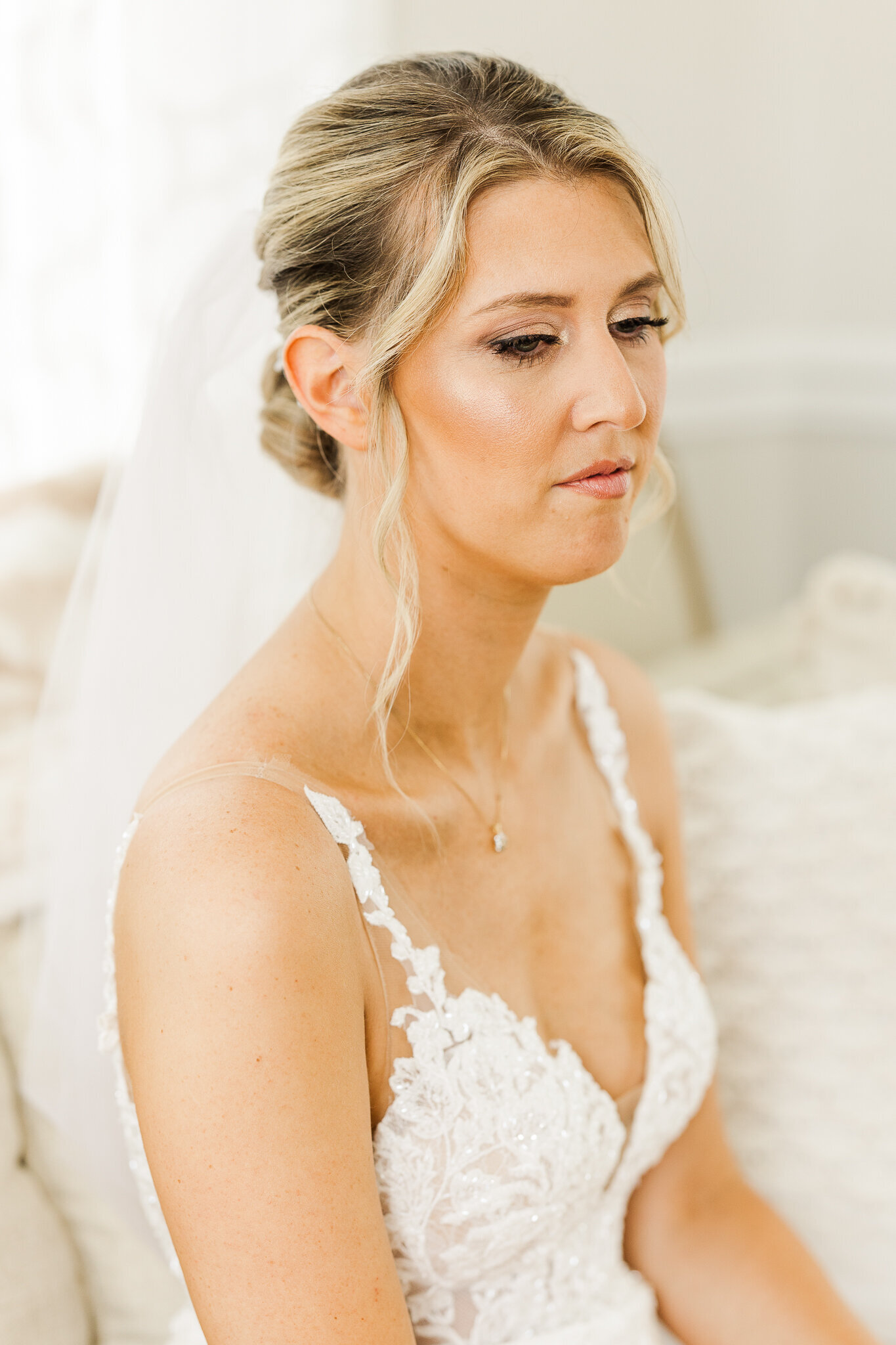 Side profile portrait of bride with soft lighting before wedding at SkyView Golf Club in Sparta