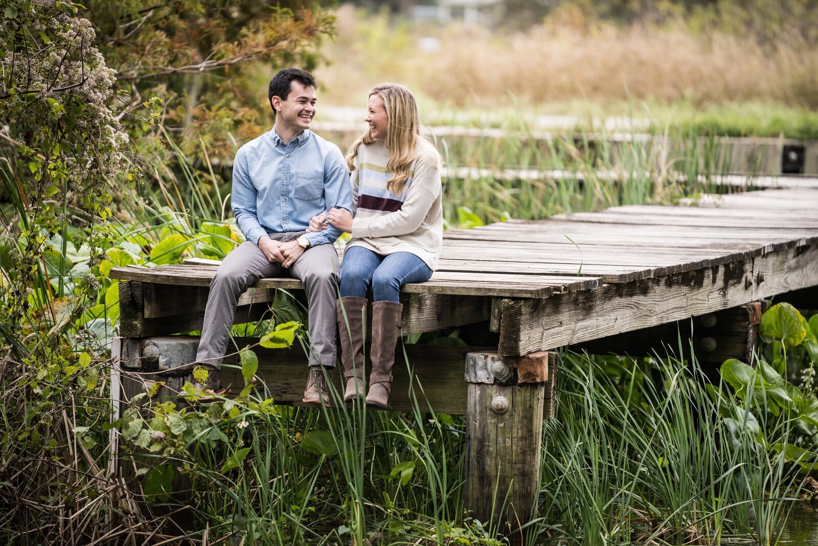 Couple sitting on dock at Lake Martin near Lafayette Louisiana