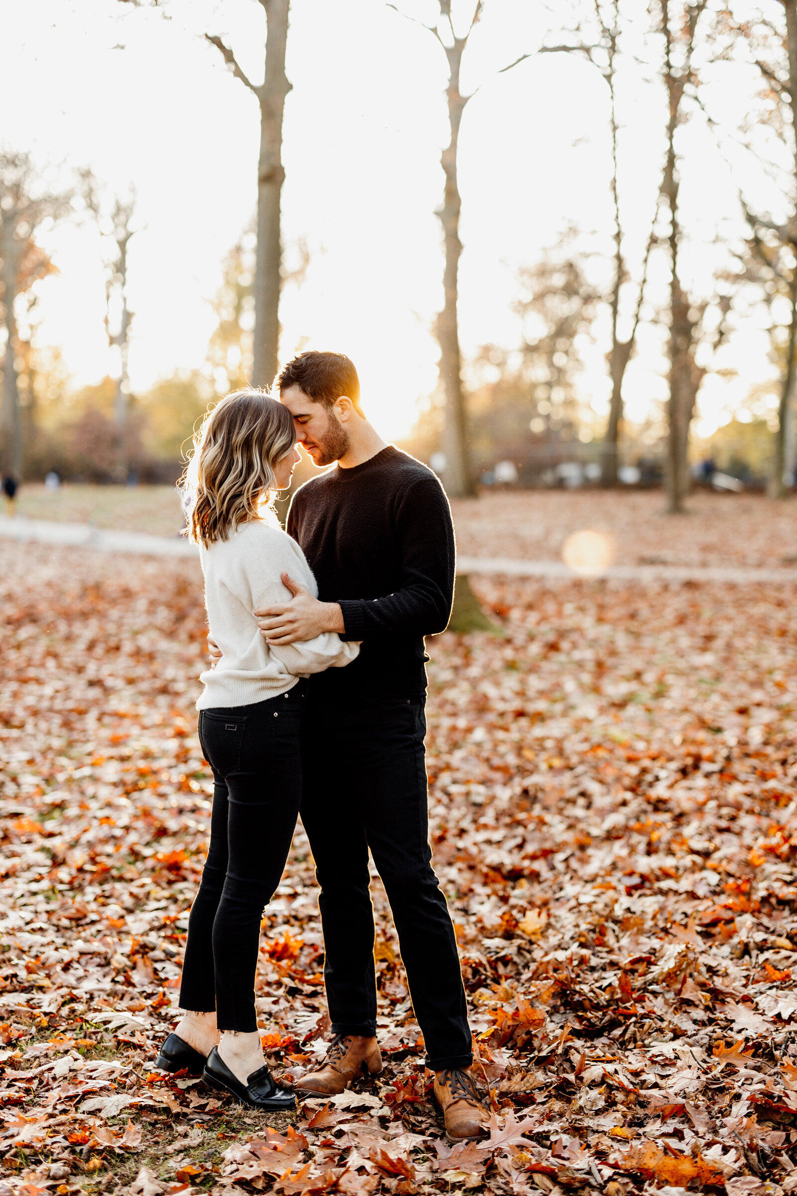 couple in colorful fall leaves