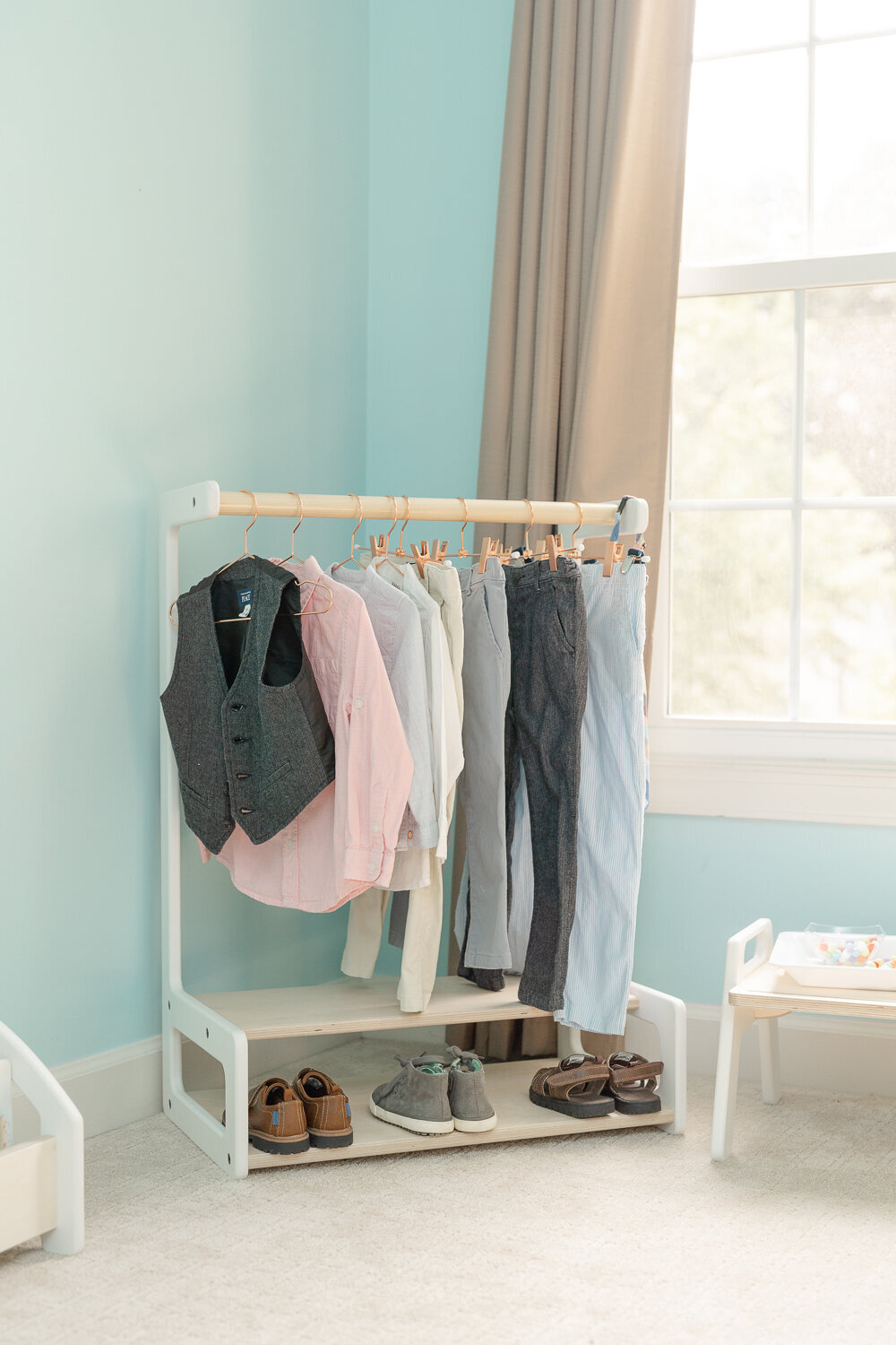 kids’ clothing rack in bedroom during Vienna,Virginia lifestyle product photo