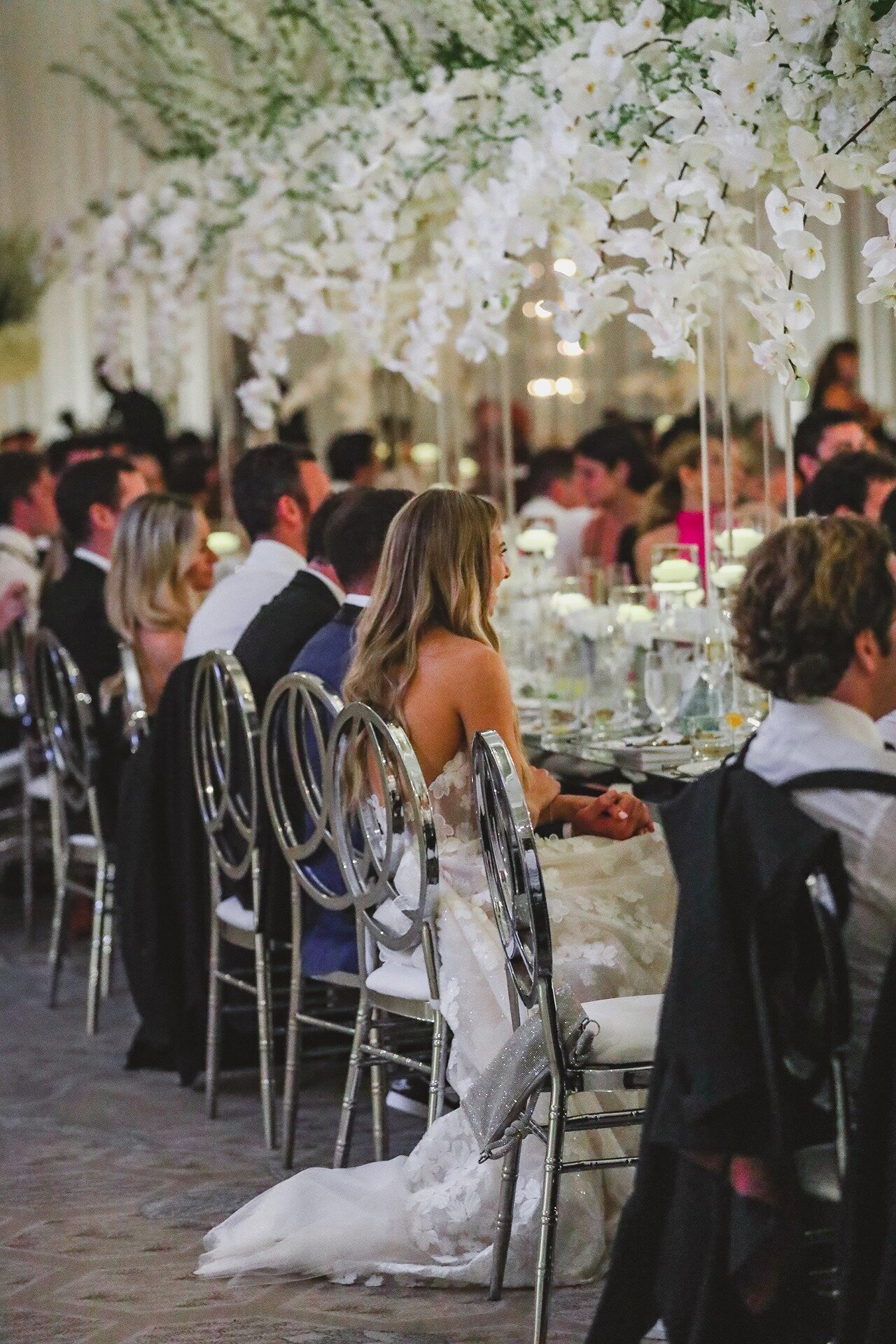 bride-smiling-reception-table-the-eau