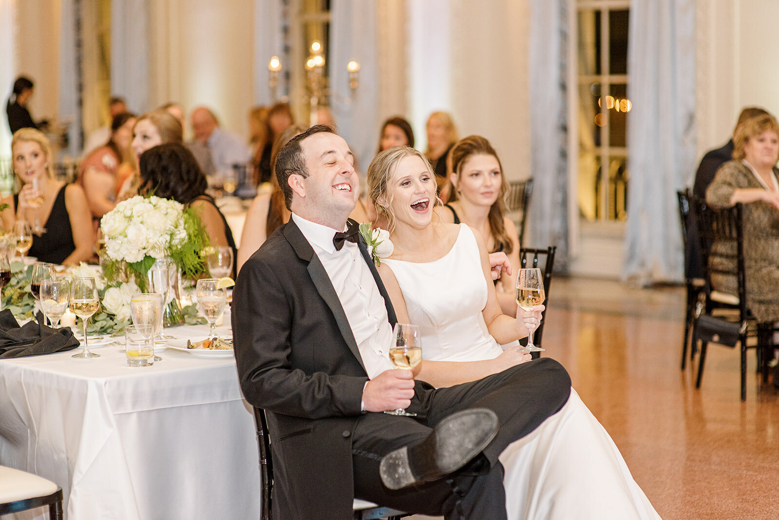couple laughing at toasts