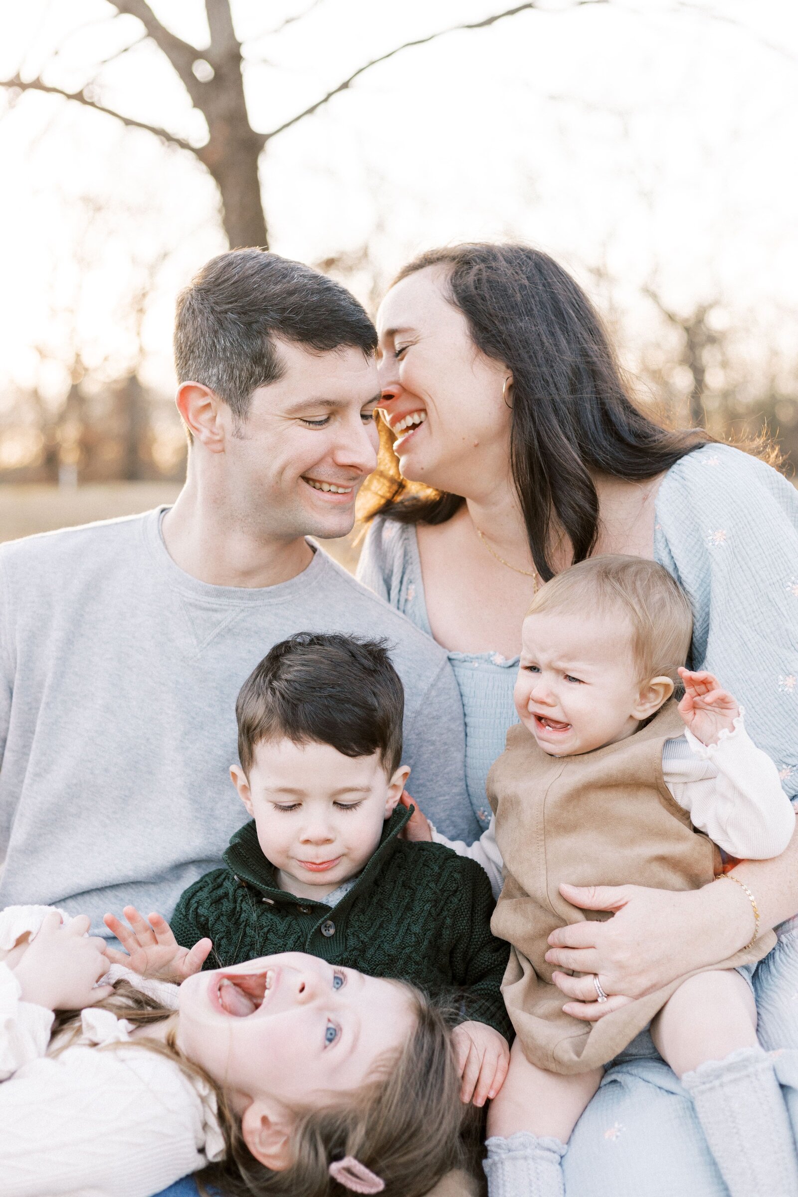 parents smiling during fall sunset peoria illinois family photos 