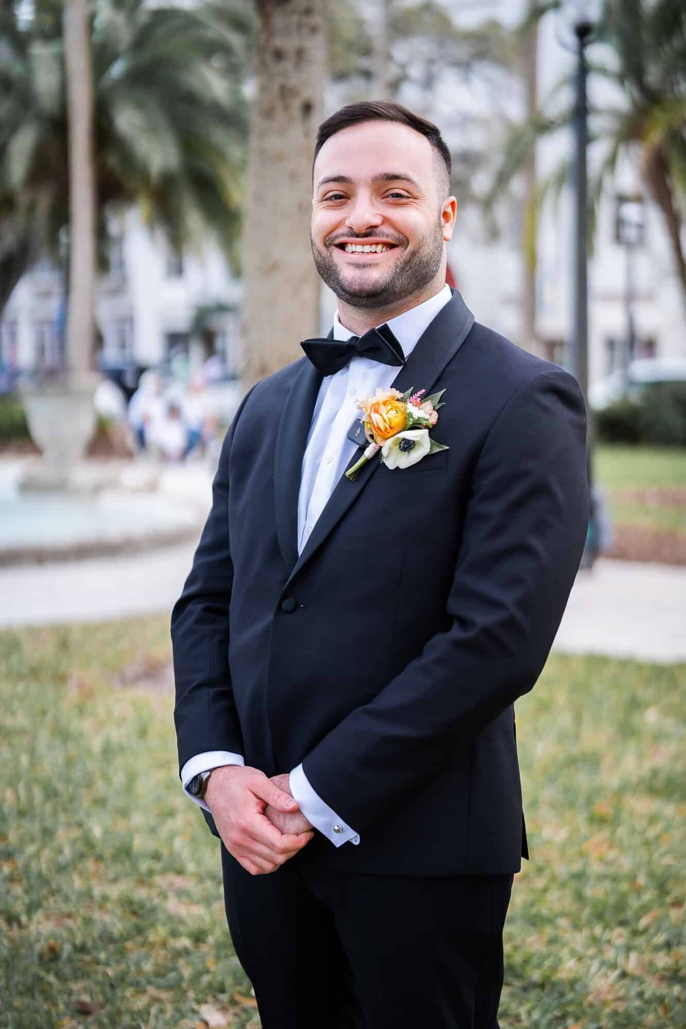 groom getting ready to see his bride for the first time - first look at Casa Monica Wedding venue in St Augustine