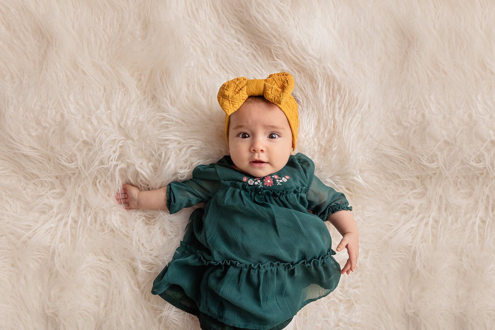 baby in yellow bow by Philadelphia Family Photographer