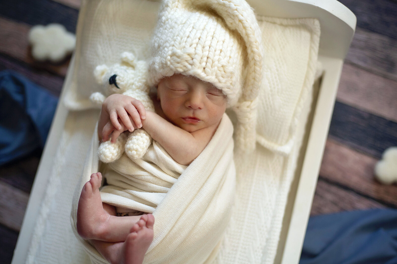 Sleeping-newborn-baby-with-PJ-hat-and-bed-prop