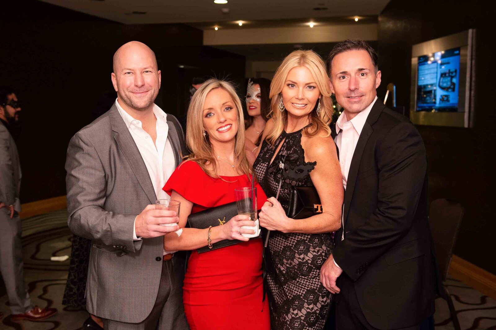 Holiday Party group of people looking at camera.-