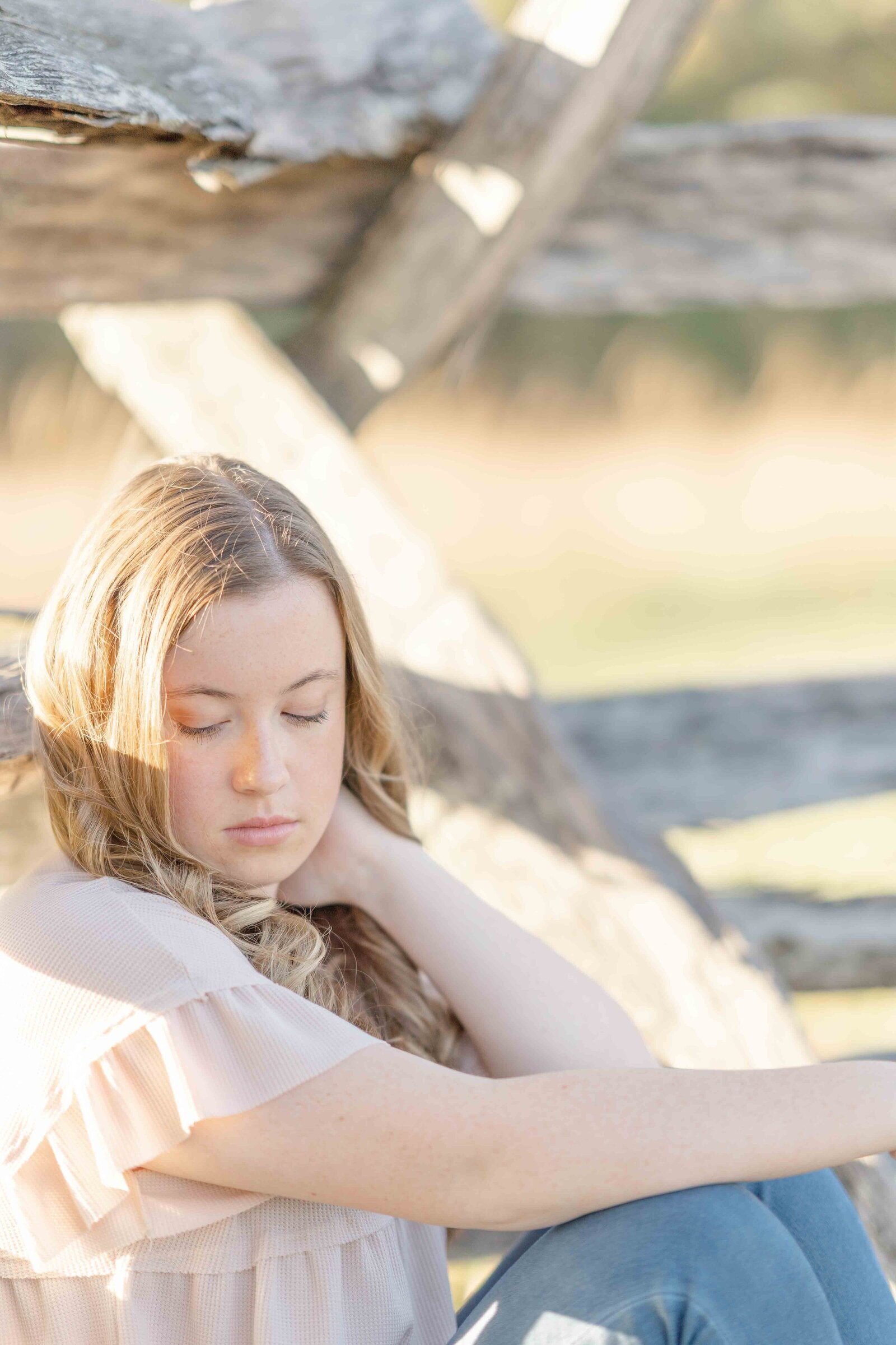 high school girl looking at her shoulder during Ashburn, VA senior photography