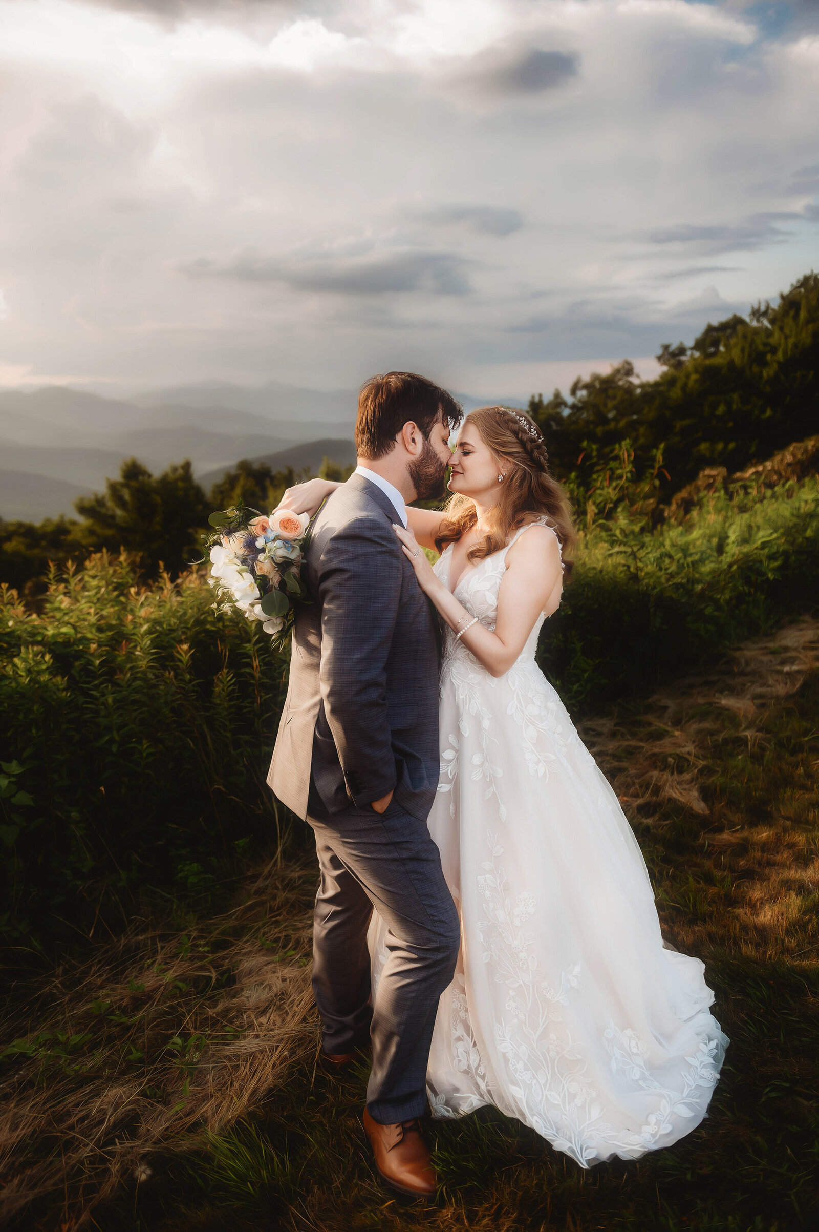 Bride and Groom embrace during their Elopement on the Blue Ridge Parkway in Asheville, NC.