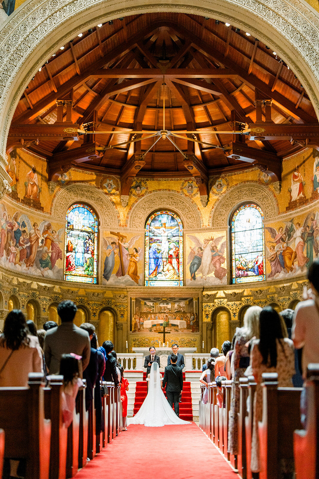 The stunning reception setup inside Stanford Memorial Church, featuring elegant decor and radiant lighting.