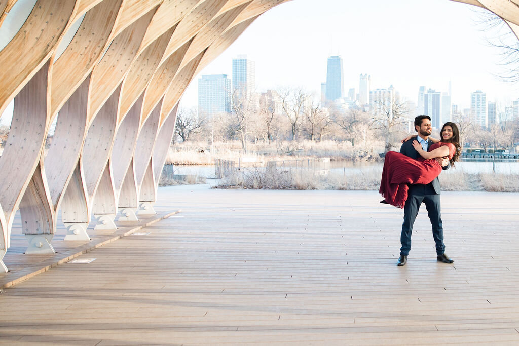 Bride with arms around groom in engagement portrait