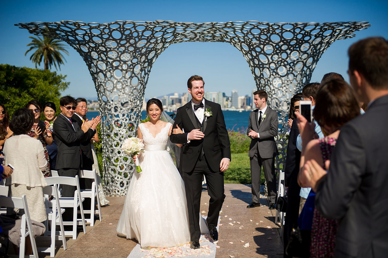 bride and groom walking down the aisle after vows