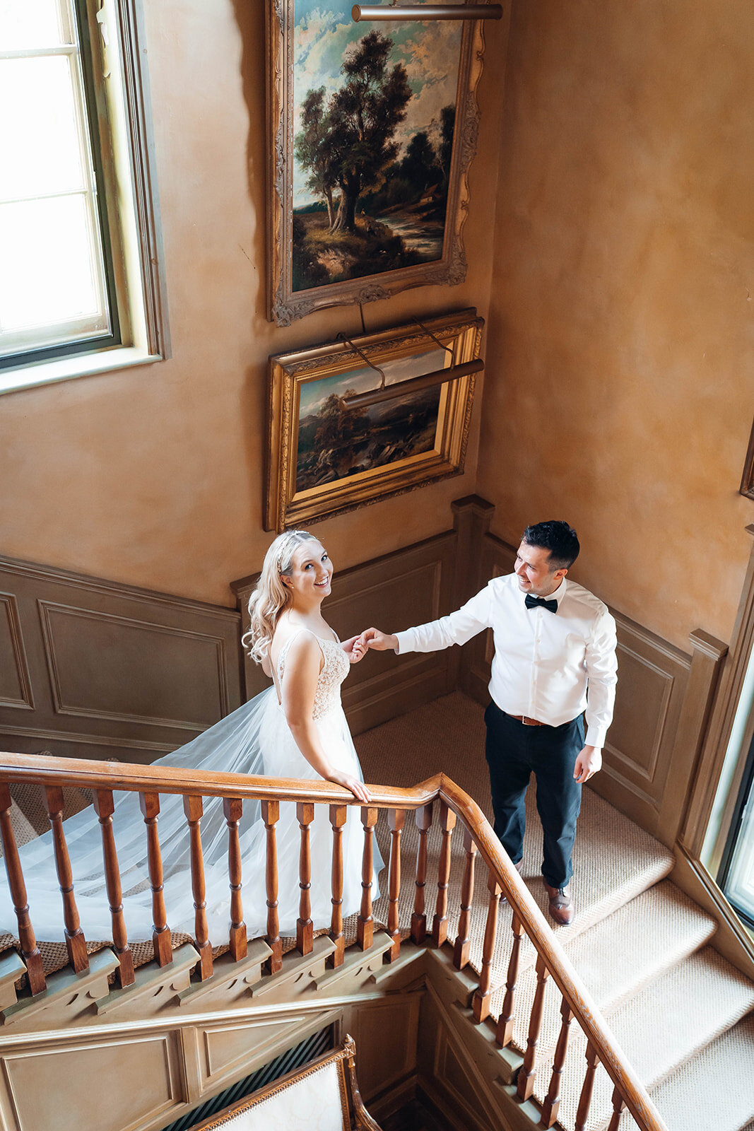 newly-married-couple-walking-down-paintley-court-stairs