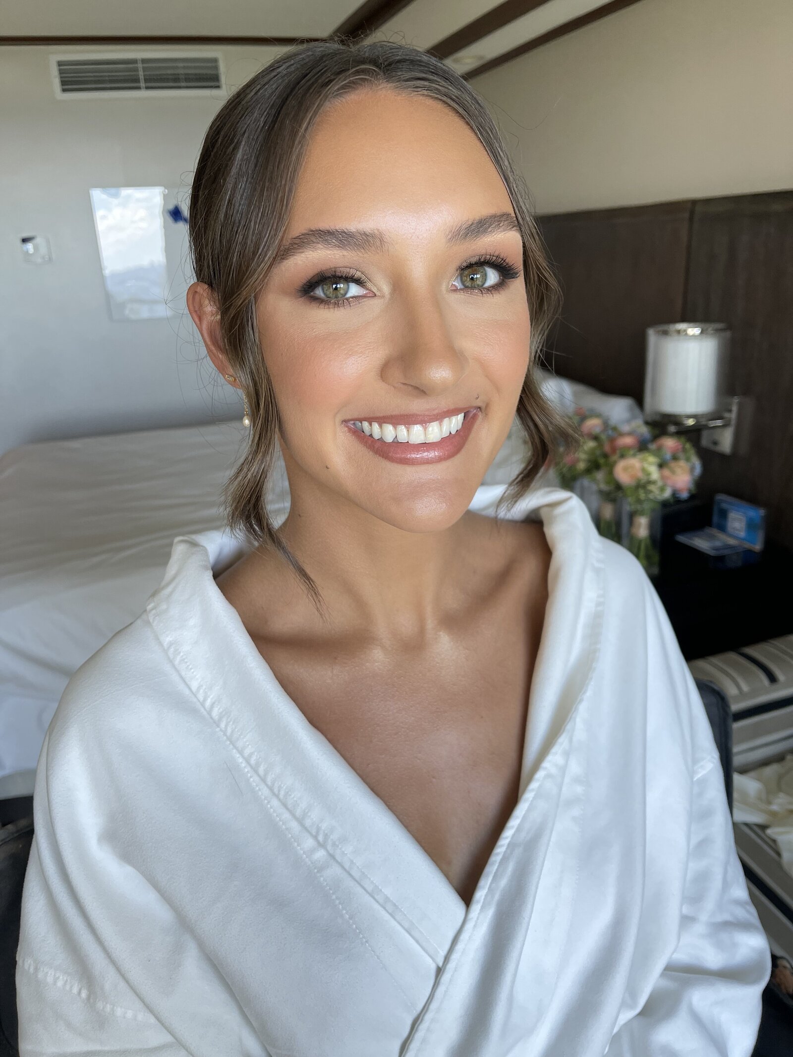 bride with her hair and makeup styled