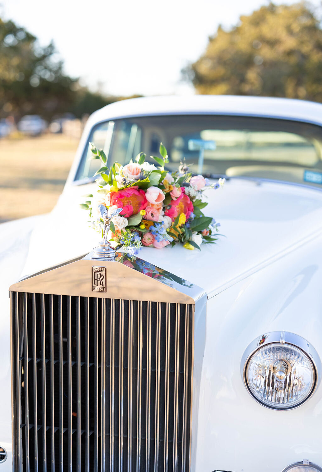 vintage car with wedding florals
