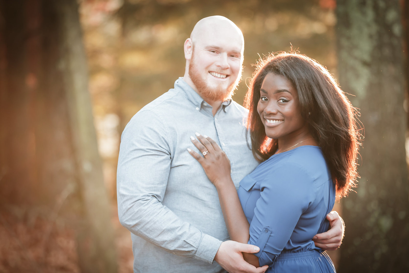 Couple smiling at Lake Wintergreen engagement session in Connecticut by Jamerlyn Brown Photography