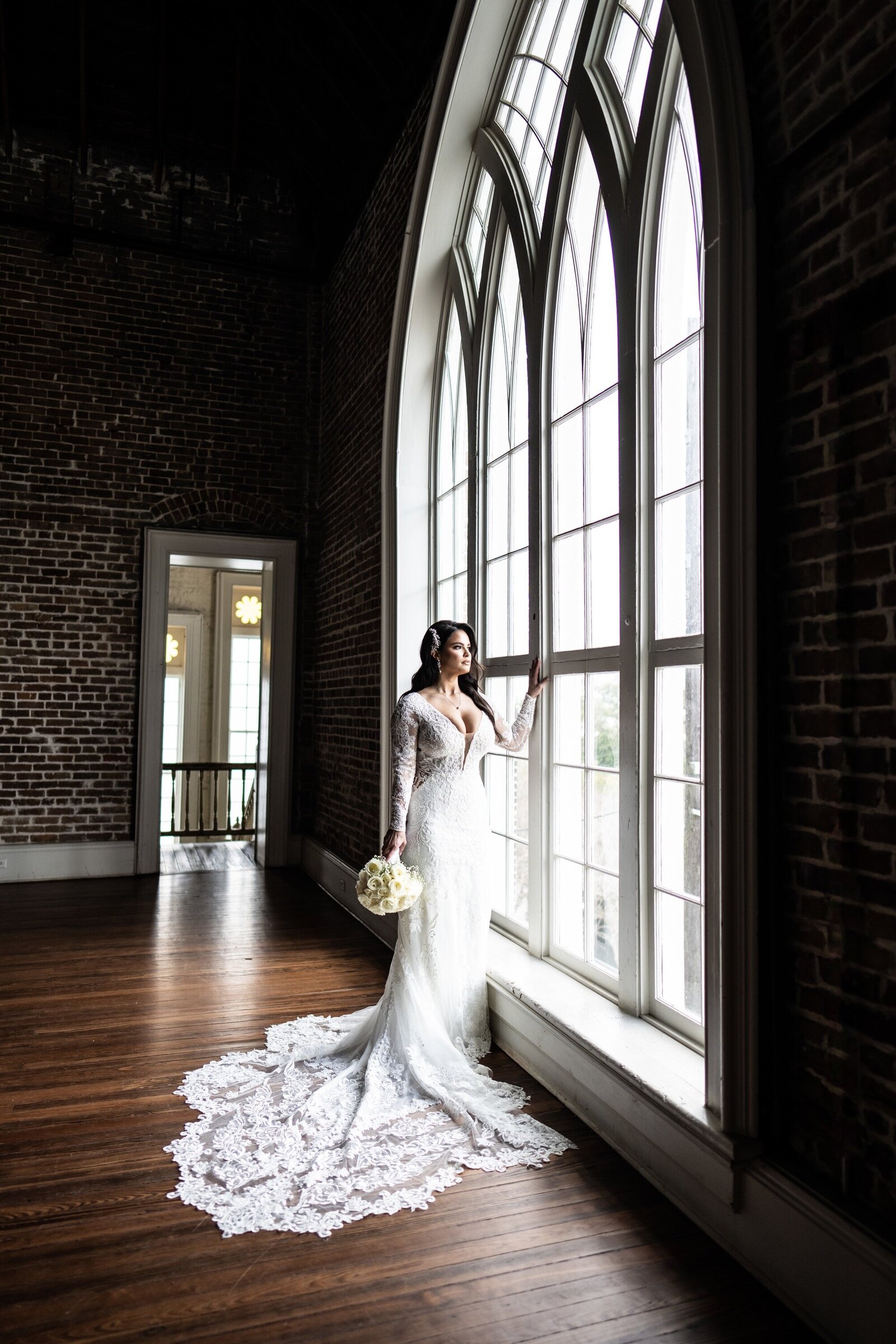 Bride in front of large window at Felicity Church