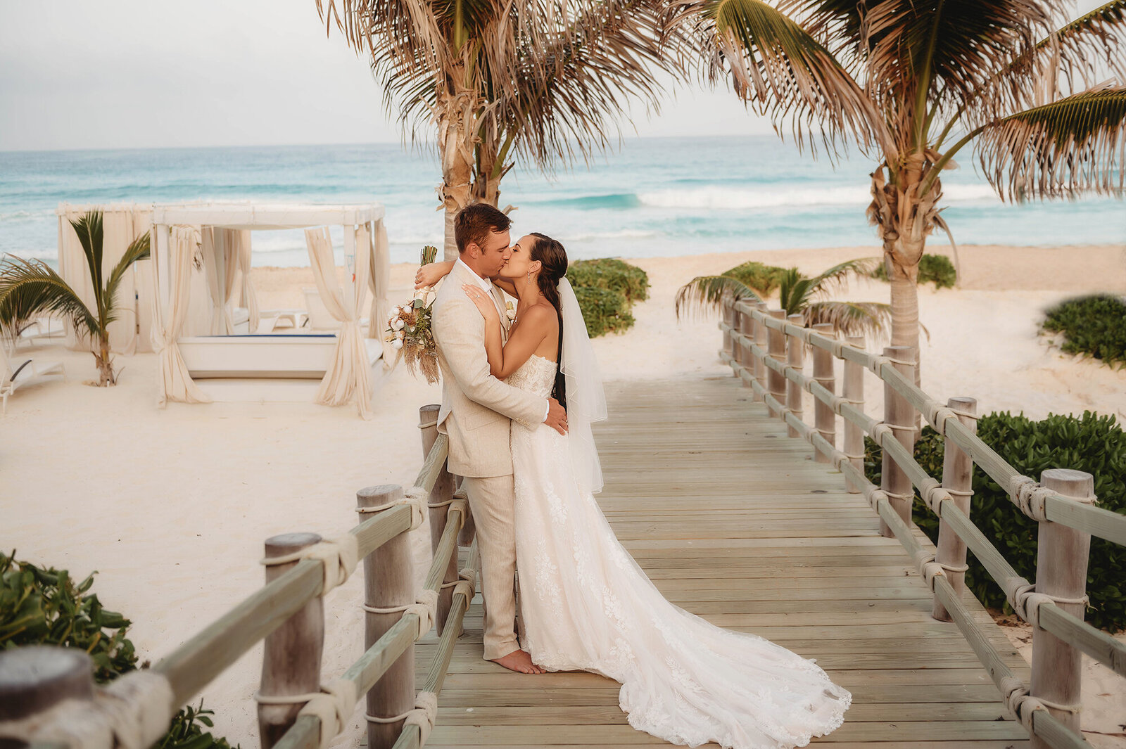 Newlyweds kiss after their Elopement Ceremony at Live Aqua Resort in Cancun Mexico.