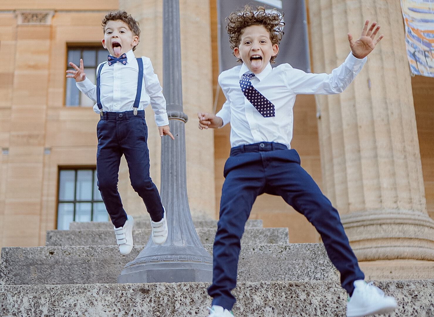 Philadelphia Family Photographer Art museum photo session authentic kids jumping image