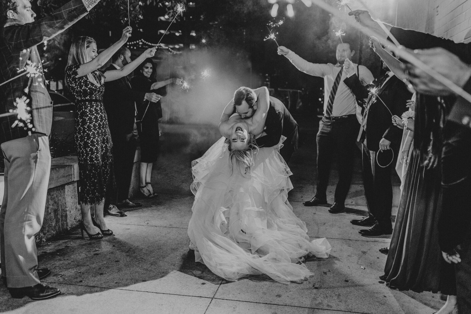 black and white wedding exit photo with sparklers
