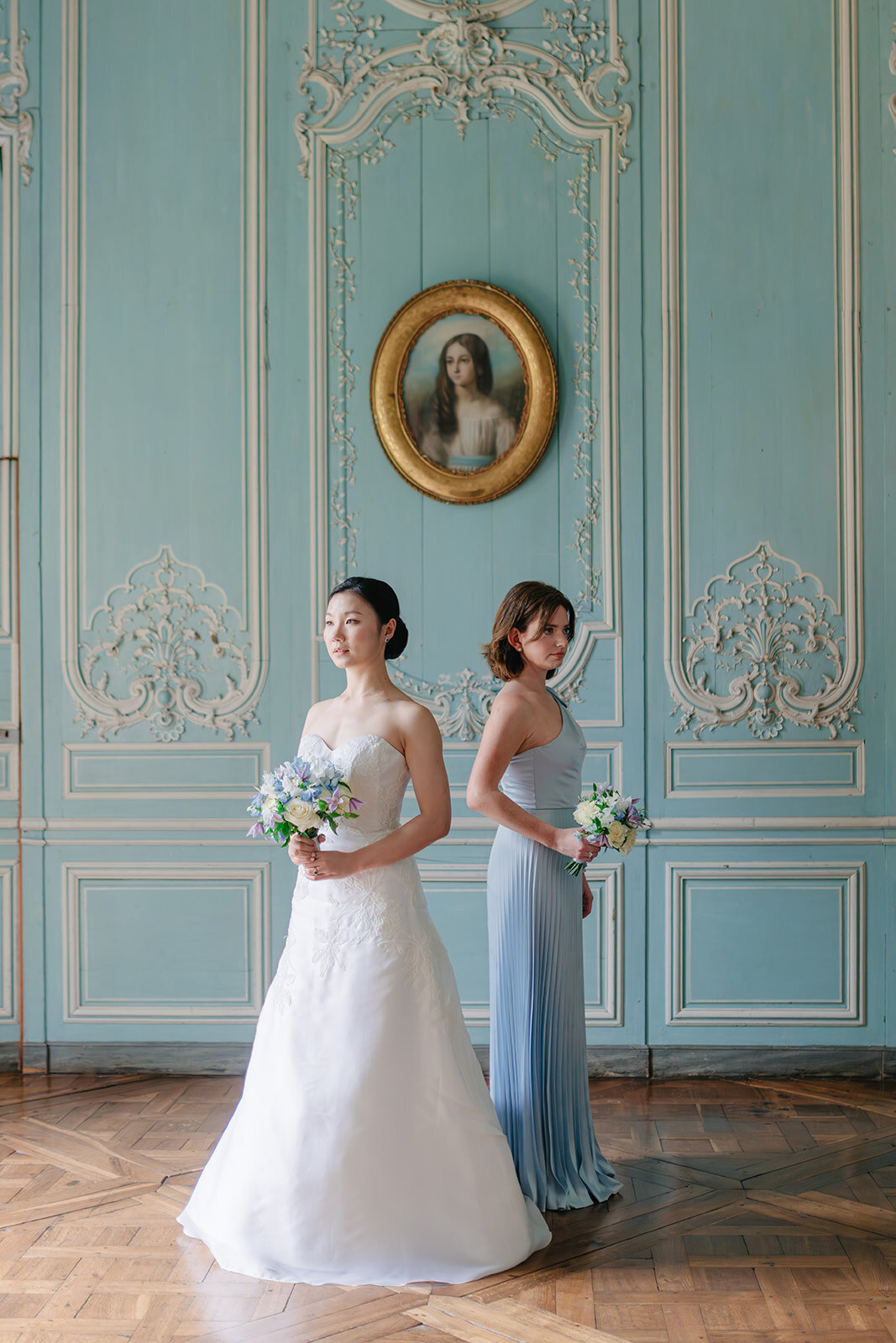 luxury wedding photographer Paris Morgane Ball Photography blue room chateau de champlatreux getting ready maid of honnor picture