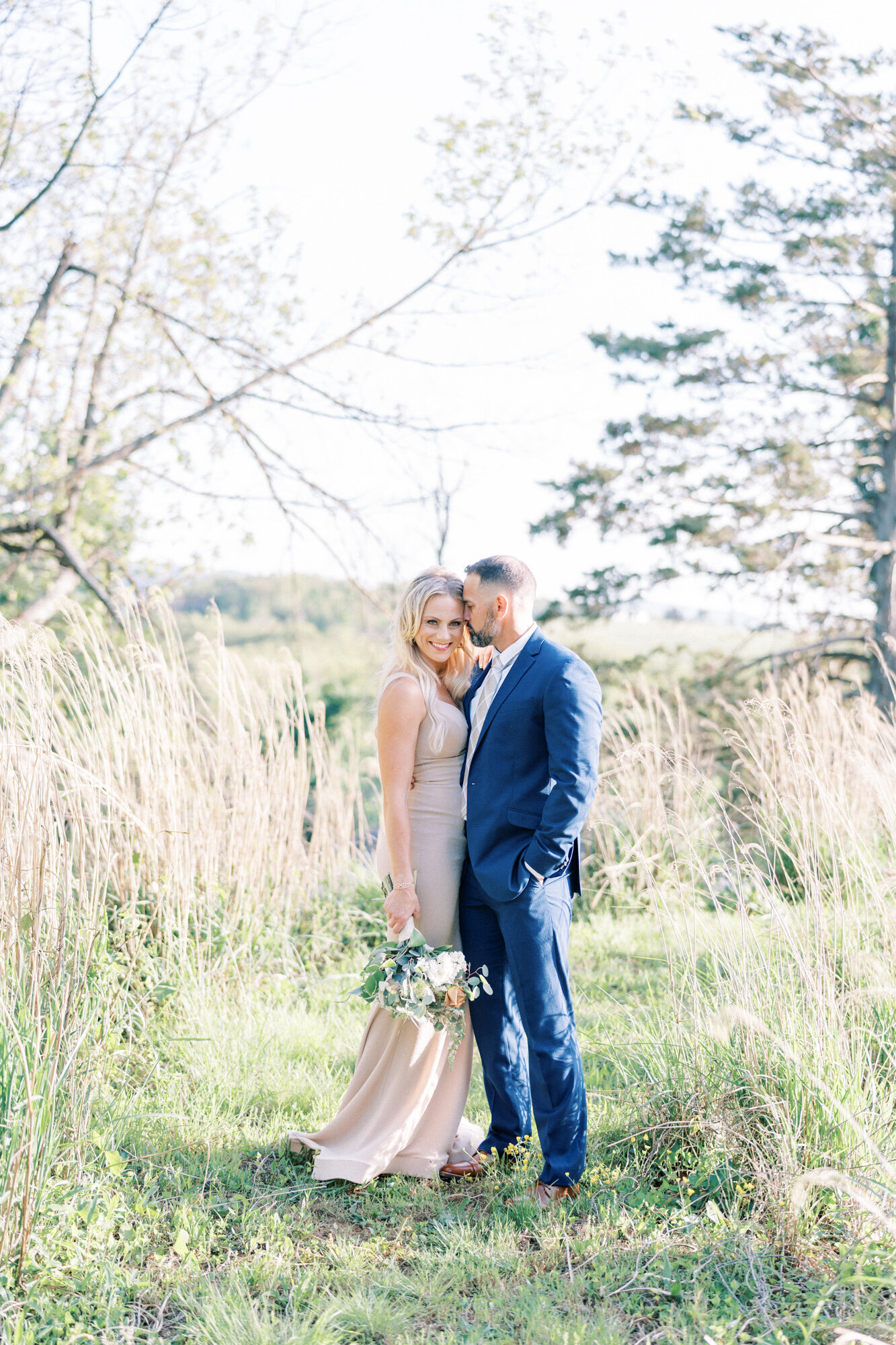 Bride and groom portraits in tall grass