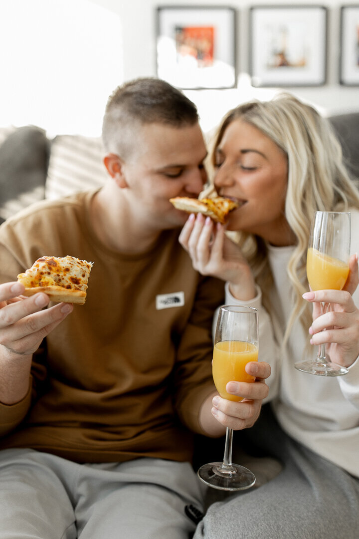 Des Moines couple eating Casey's pizza on their living room floor