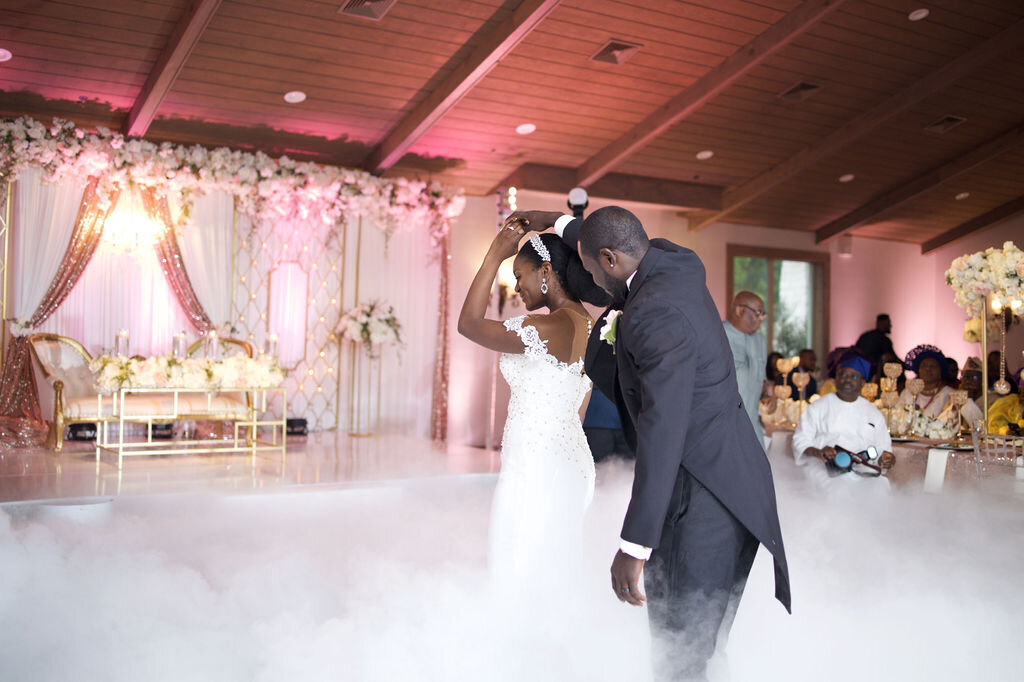 Bride and Groom dancing the first dance with fog