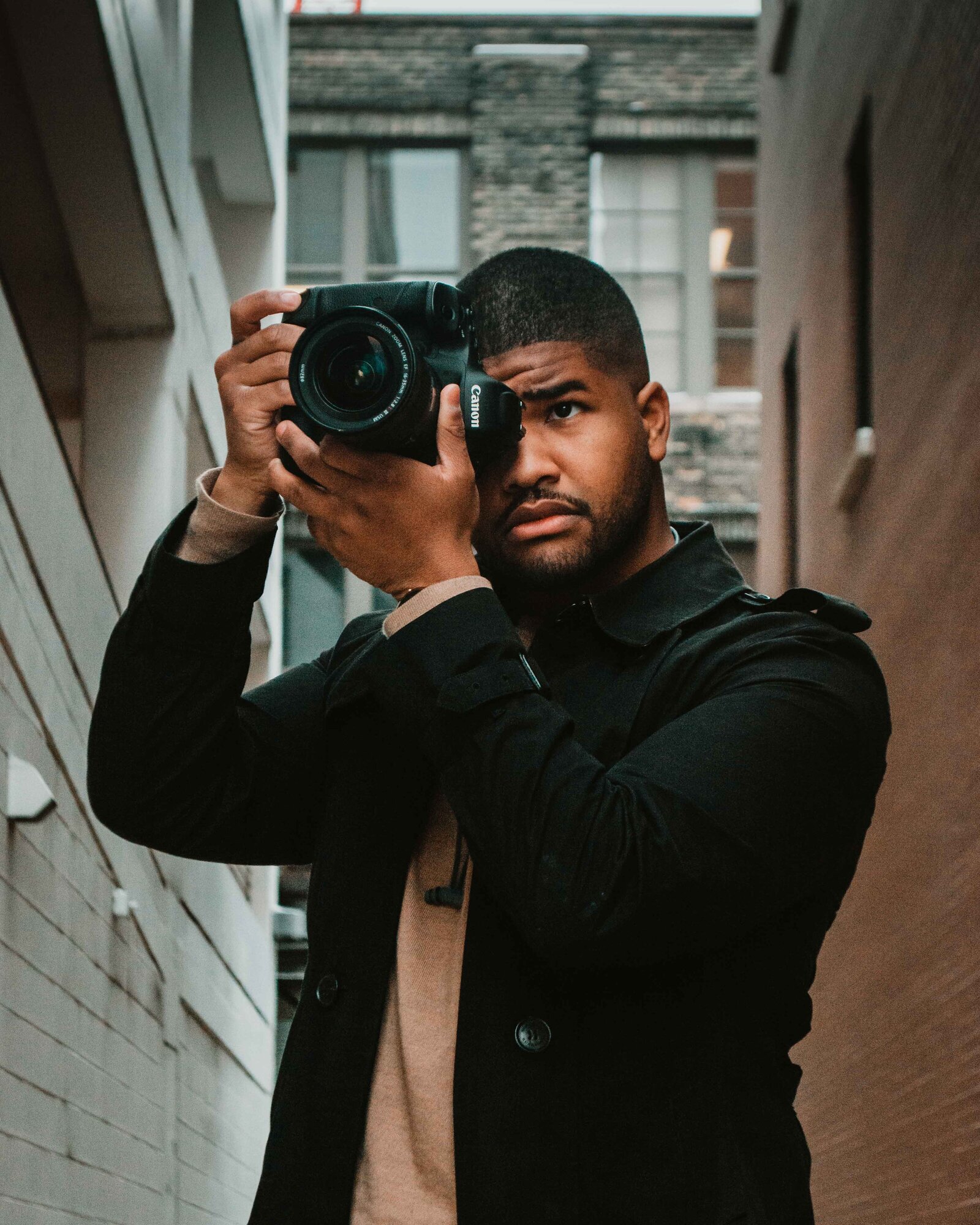 Sidney holding his camera