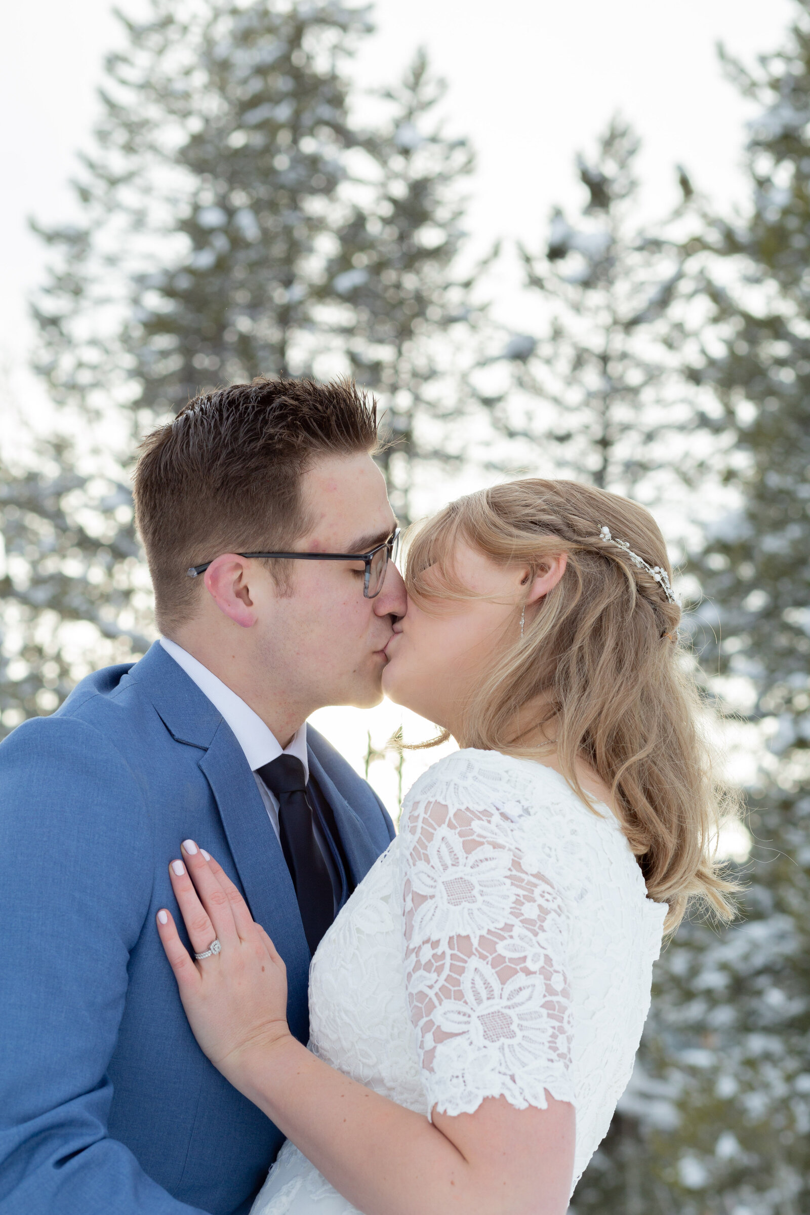 Idaho wedding photographer captures couple kissing during spring wedding