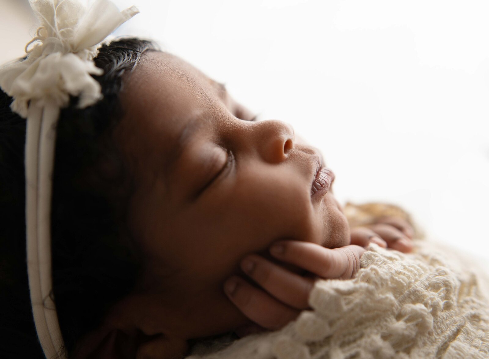 Macro profile shot of baby's face details. Photographed by Jenni Nikki Photography at Marietta Newborn Photo Studio.