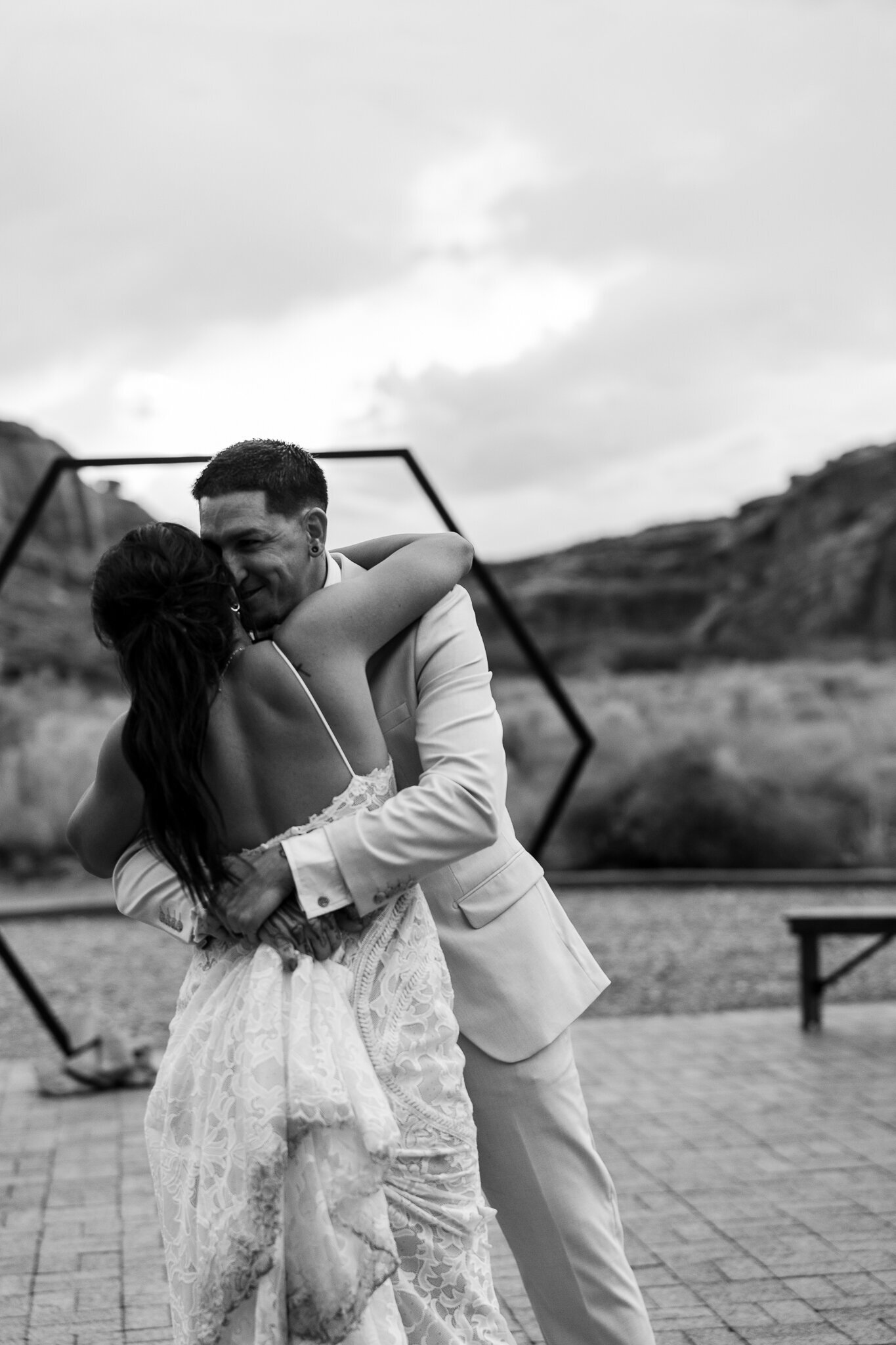 Groom kisses bride after their first dance at their wedding in moab utah