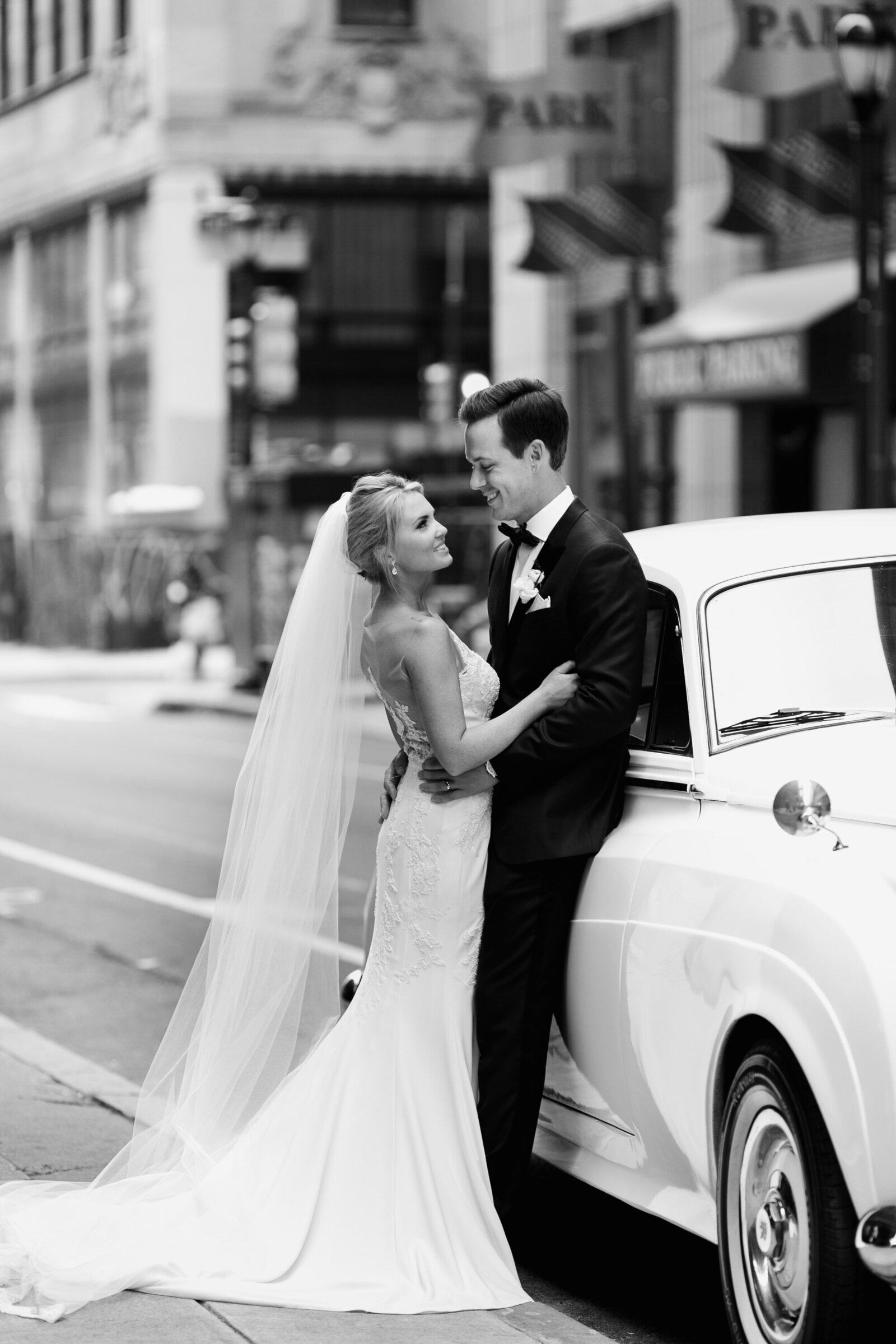 bride and groom with vintage classic car