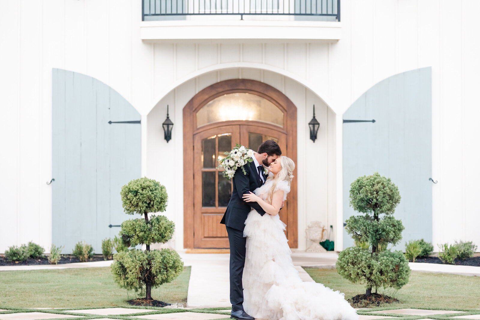 bright light and airy wedding photo of bride and groom wedding venue