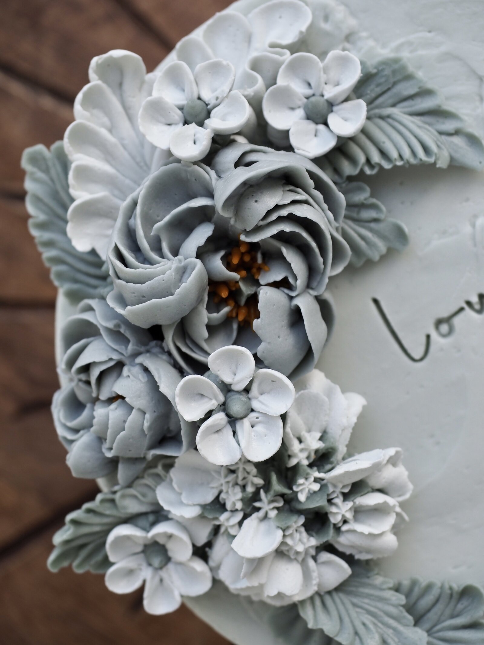 Grey and white buttercream flower cake