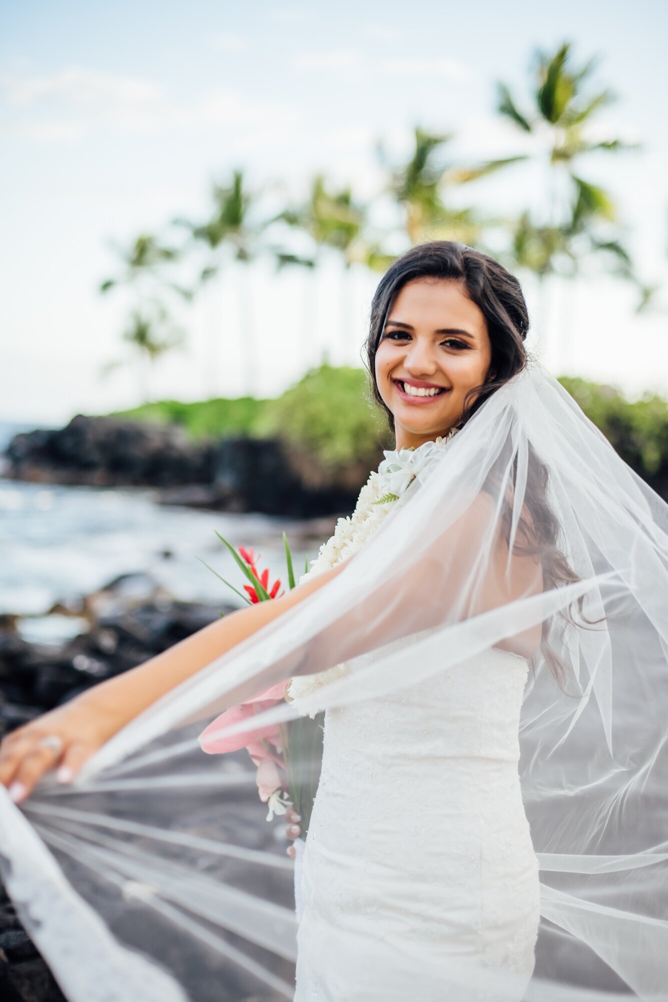 bride and her beautiful long veil during her hawaii wedding