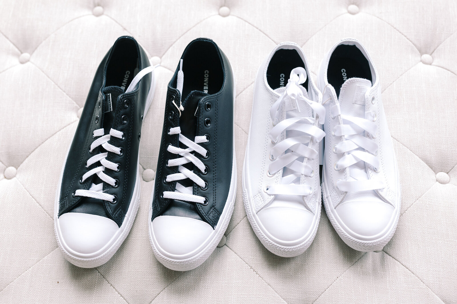 detail shot of bride and grooms shoes sitting on a white leather seat captured by sacramento wedding photographer