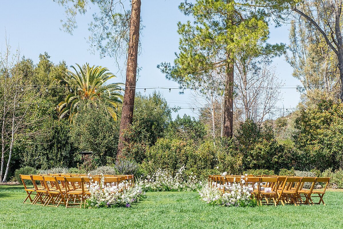 The Lodge at Malibu Lake wedding ceremony florals and set up.