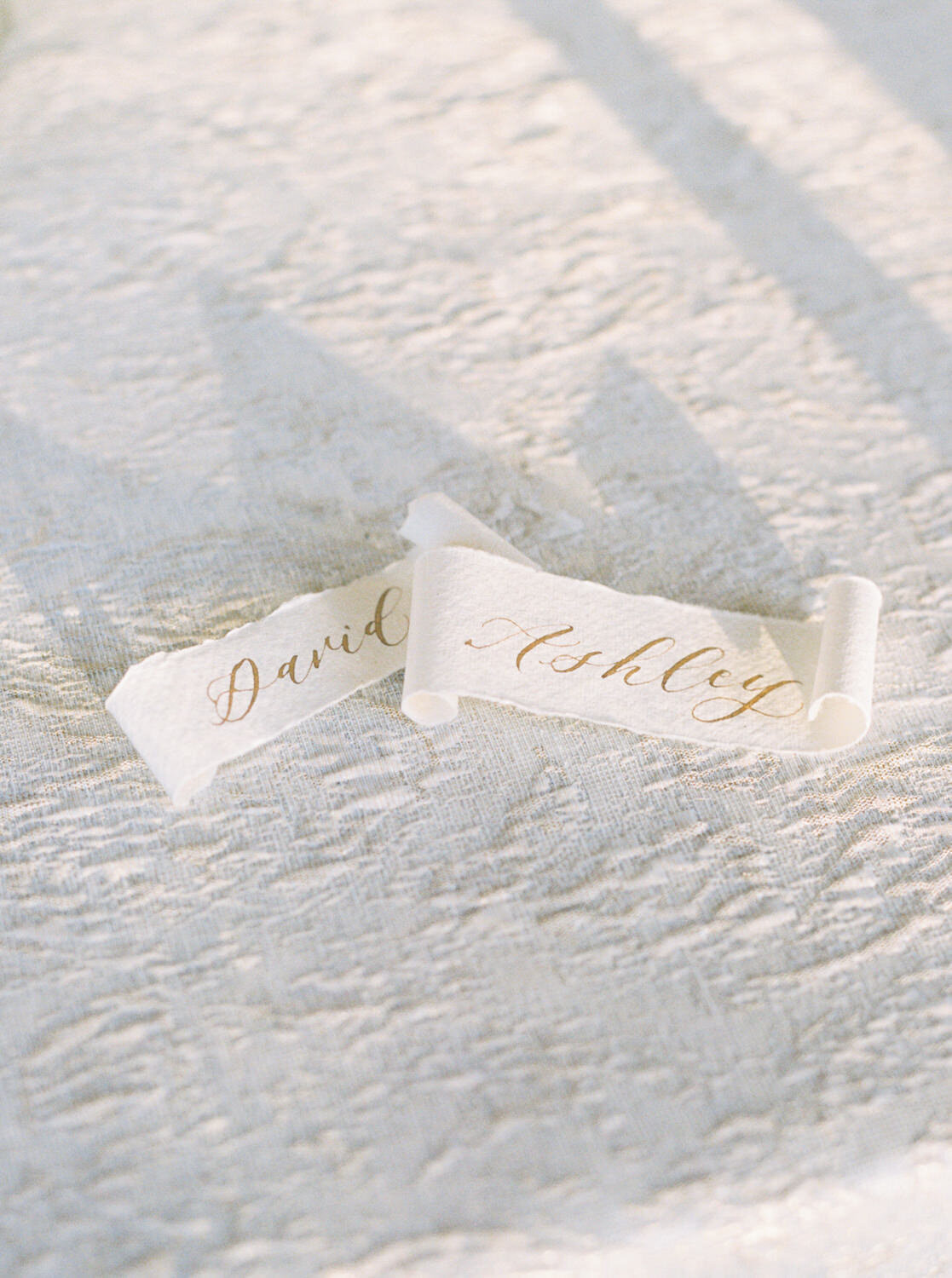 Bride and Groom name tags on luxury linen.