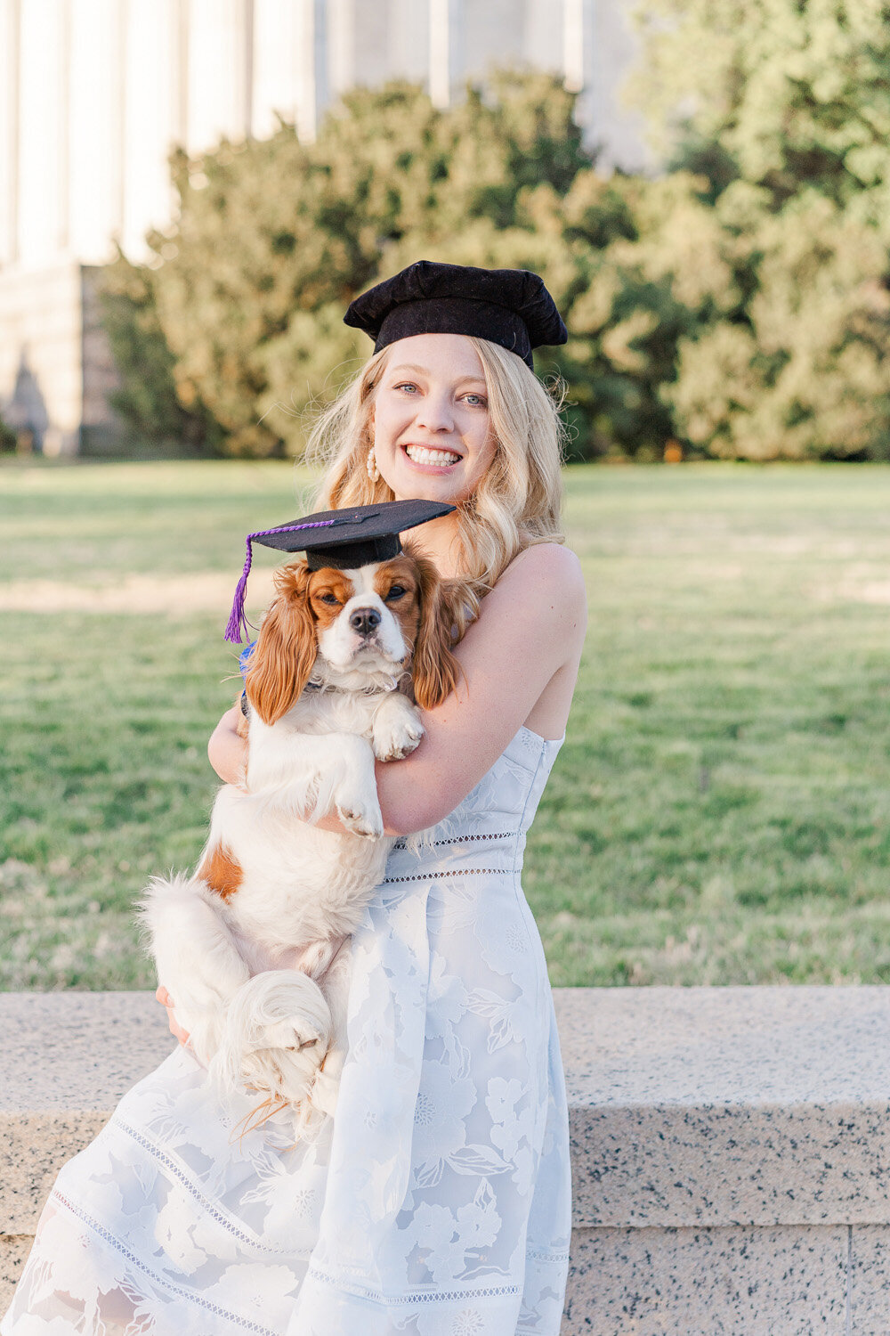 senior girl with matching graduation cap as her dog in Washington, DC