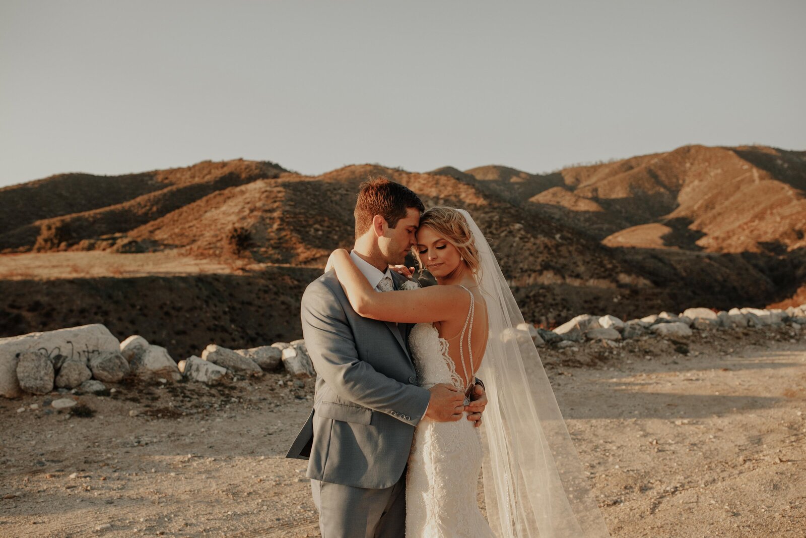 bride and groom embracing