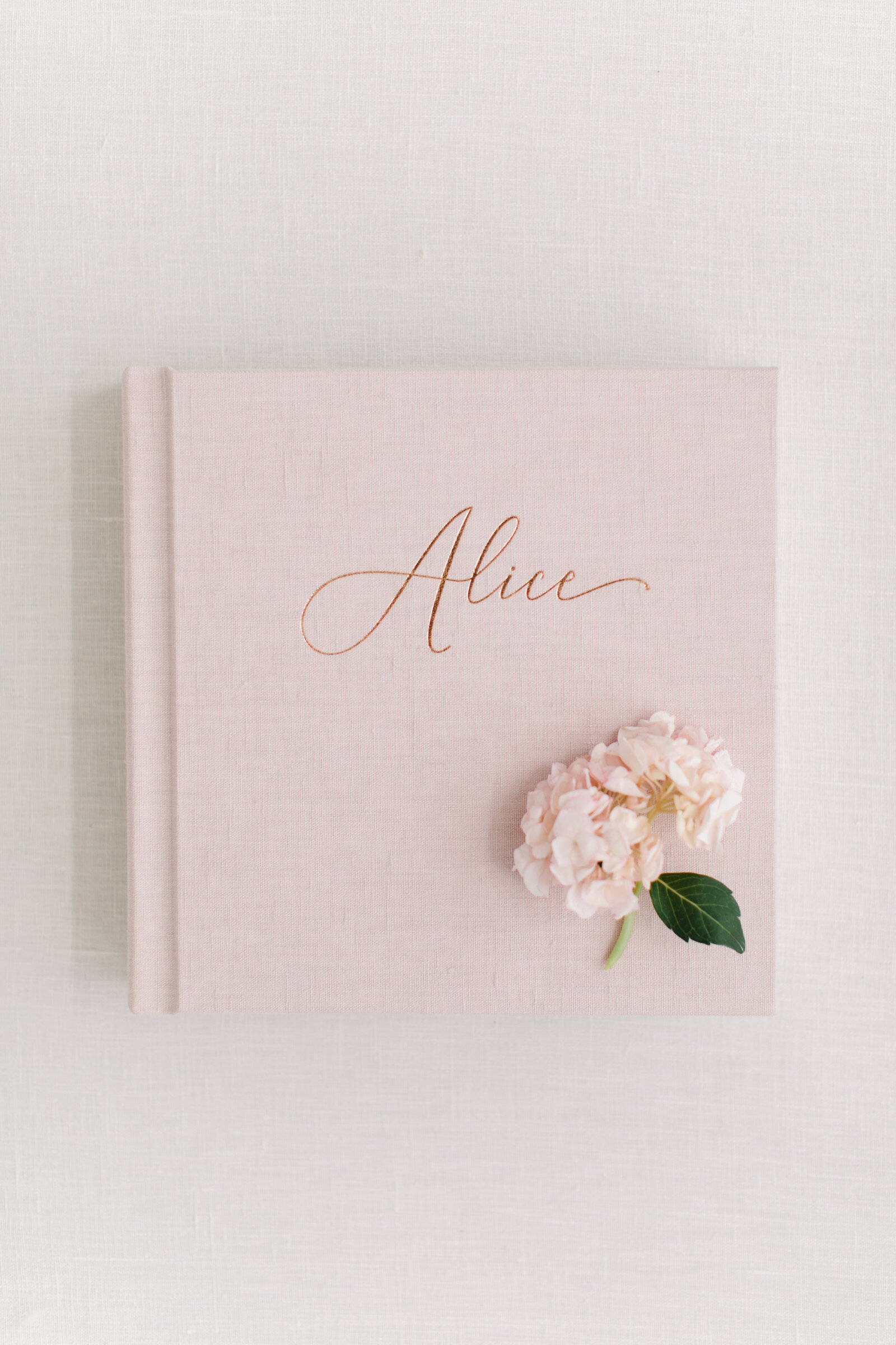 Baby book with custom luxury font.