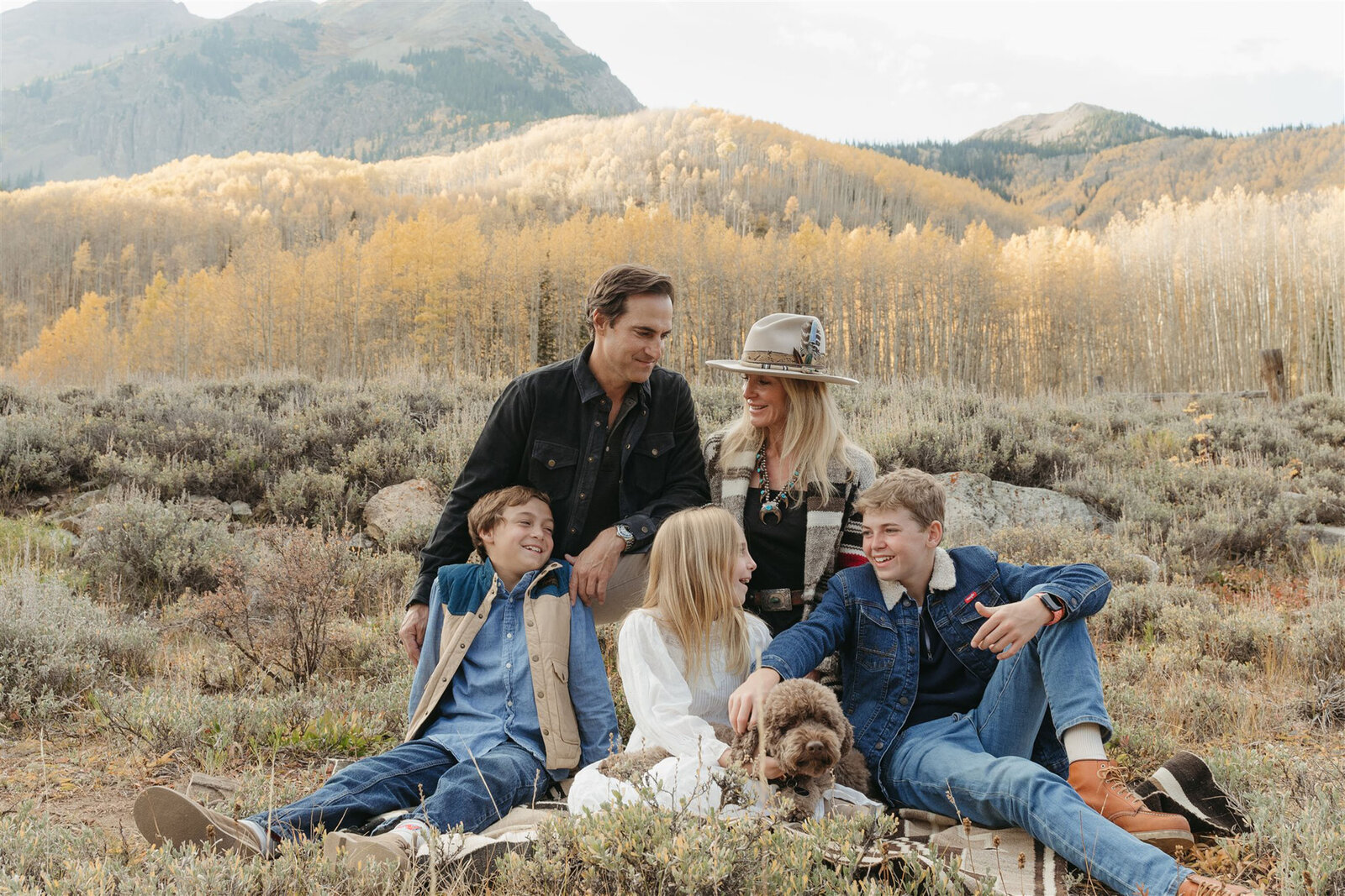 Editorial-style Aspen couples portrait — classic layers and refined textures styled against the Rocky Mountain backdrop.