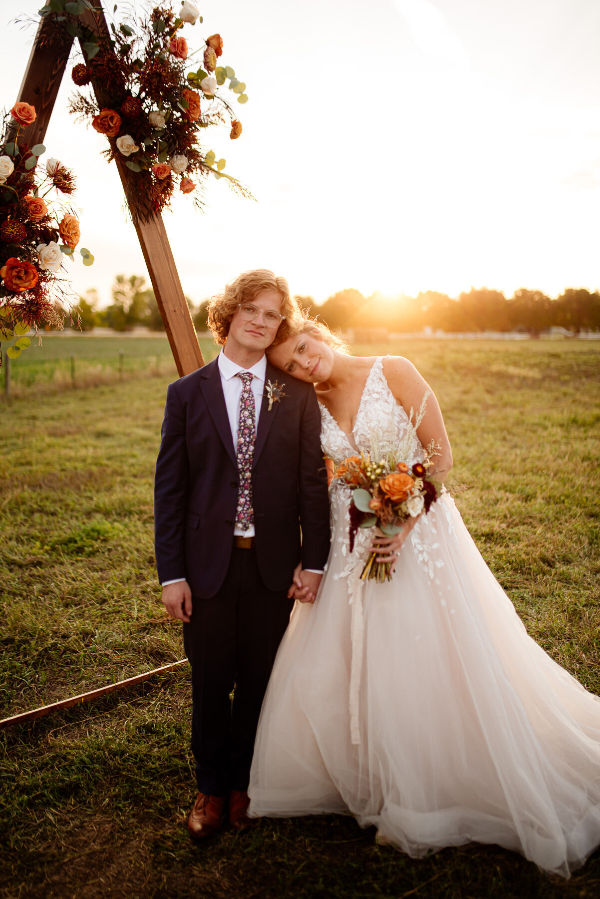 young married couple posed at sunset in Northern Colorado.