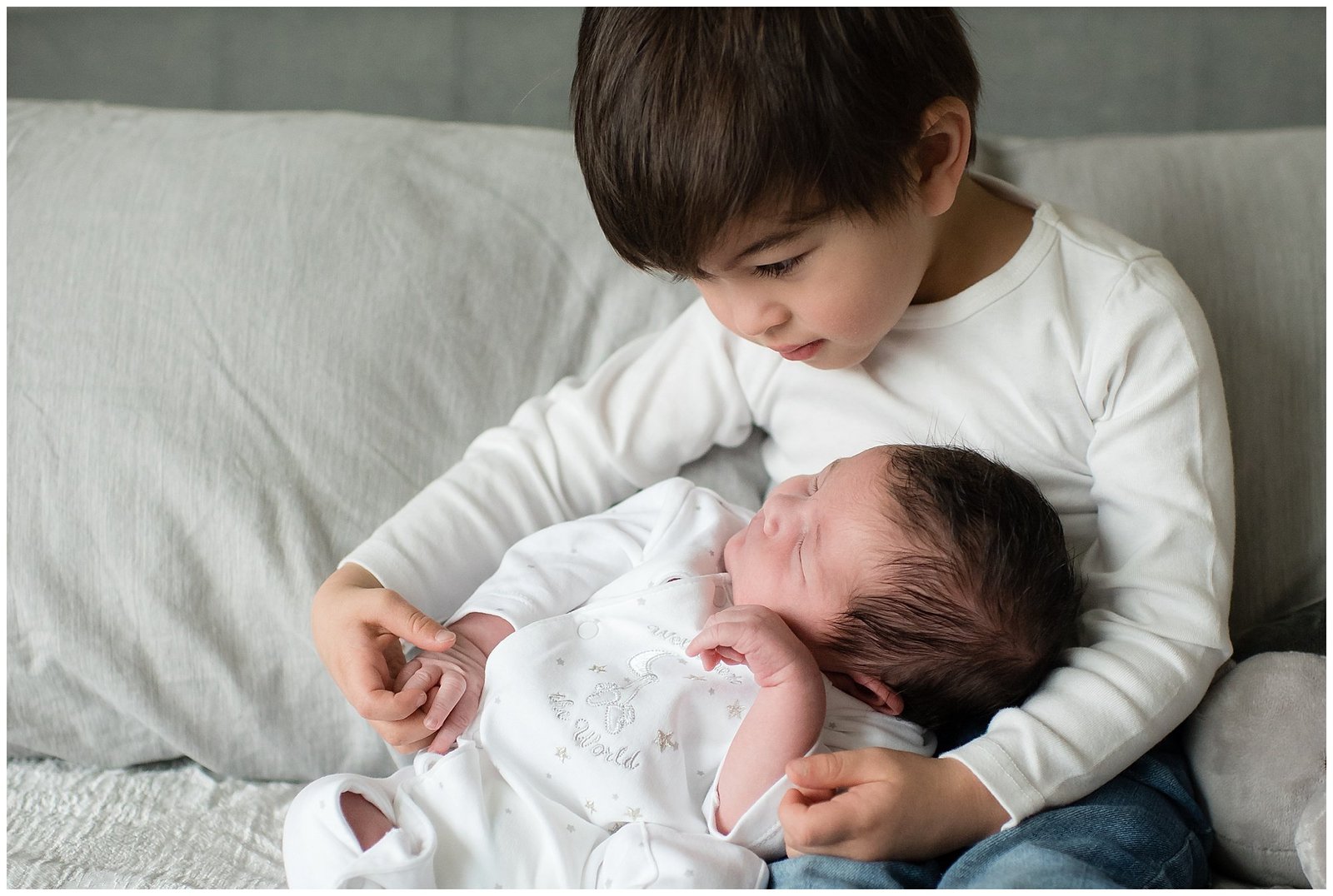 Big brother counting baby brothers fingers and toes Emily Ann Photography Seattle Area Photographer.