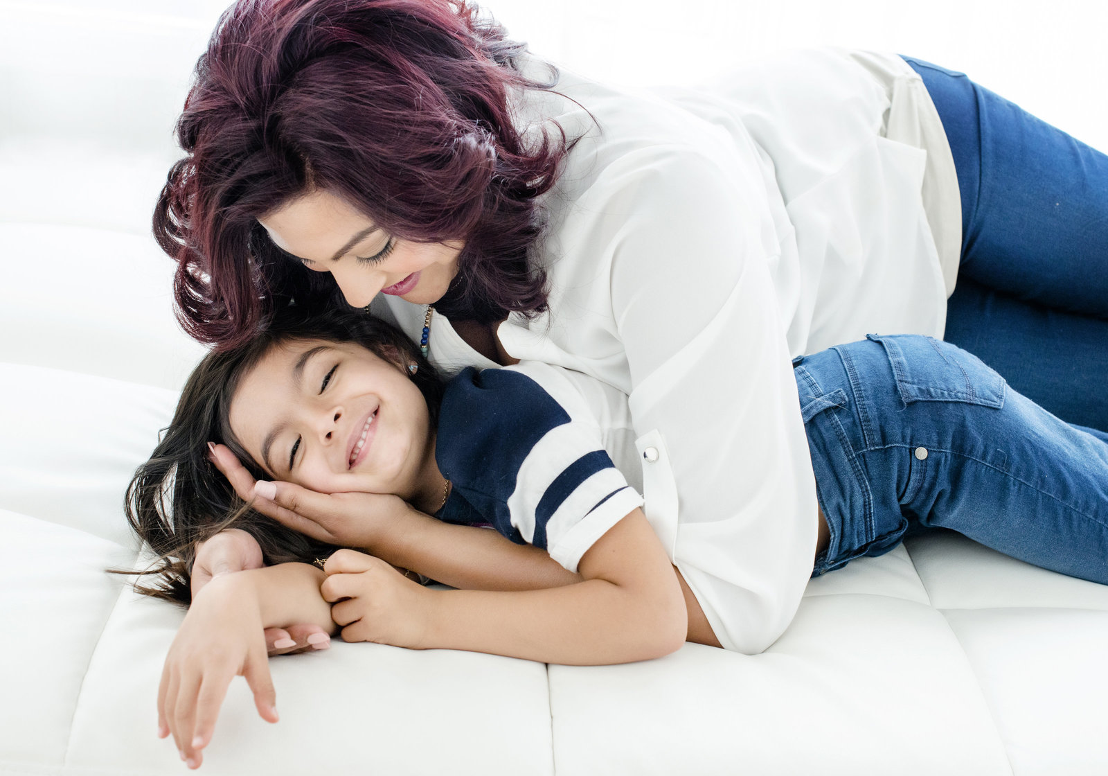 personal branding Portrait of young  girlhave fun with mother , creating precious memories  wearing white clothes and jeans